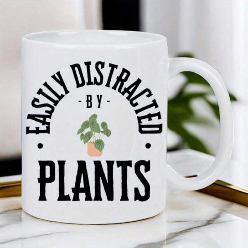 Tailorly White Ceramic 11 oz Mug - Easily Distracted By Plants Potted Green Leaf Growing In Pink Pot Inside Decorative Garden Plant