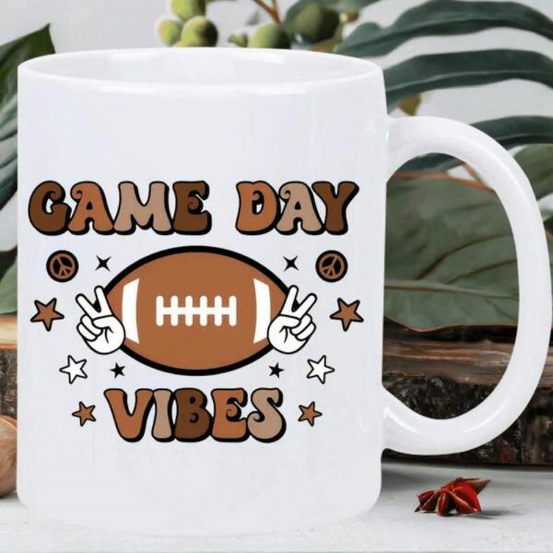 Tailorly White Ceramic 11 oz Mug - Game Day Vibes Stylized Brown Sports Ball Surrounded By Retro Stars And Peace Signs Football