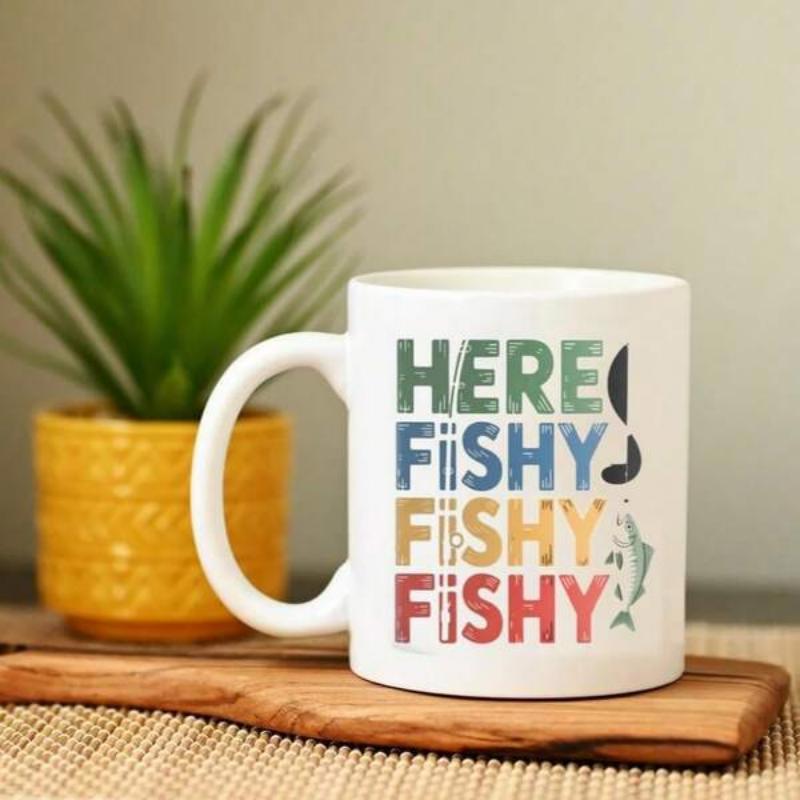 Tailorly White Ceramic 11 oz Mug - Here Fishy Fishy Fishy Distressed Colorful Typography Beside A Tiny Hook And Swimming Small Fish
