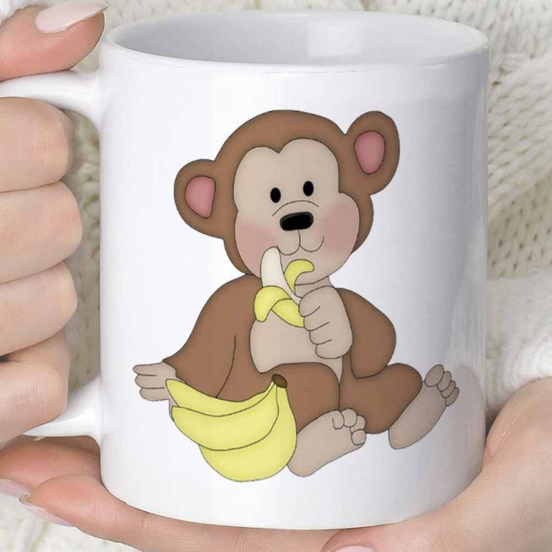 Tailorly White Ceramic 11 oz Mug - Adorable Brown Baby Primate Sitting And Eating A Fresh Yellow Banana Monkey