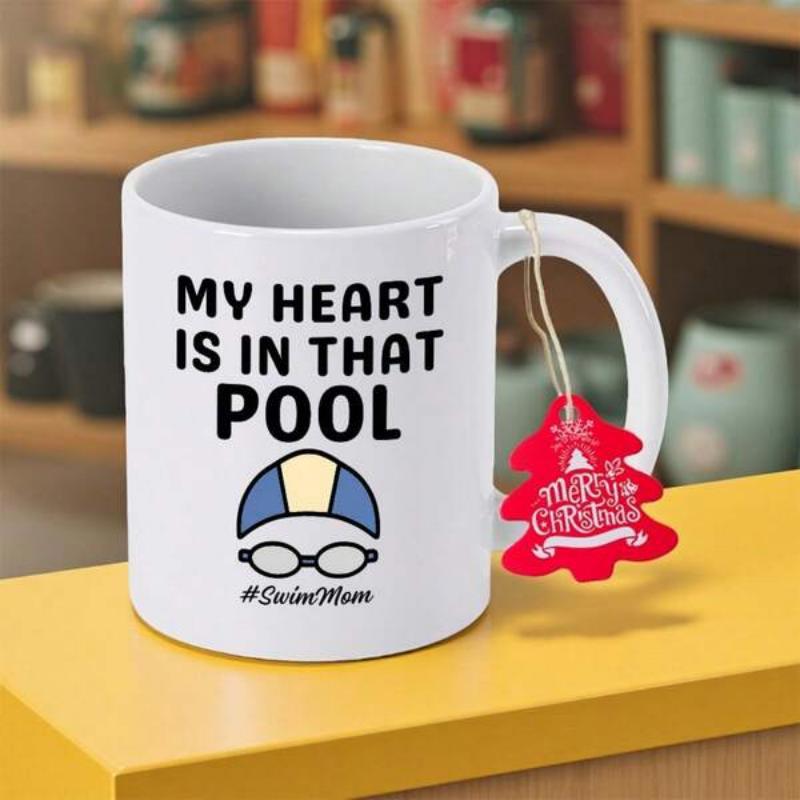 Tailorly White Ceramic 11 oz Mug - My Heart Is In That Pool Swim Mom Stylized Blue Swimming Gear Resting Neatly Under Bold Black Text Goggles