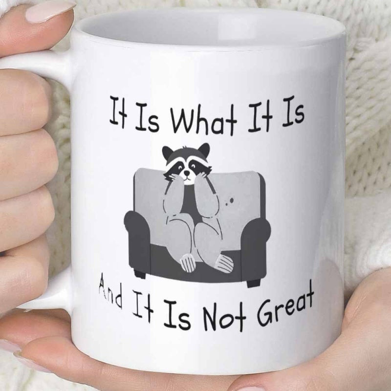 Tailorly White Ceramic 11 oz Mug - It Is What It Is And It Is Not Great Exhausted Small Raccoon Sitting Comfortably On A Modern Gray Minimalist Sofa Raccoon