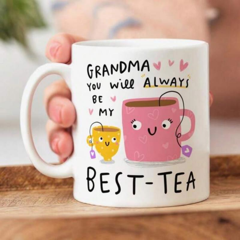 Tailorly White Ceramic 11 oz Mug - Grandma You Will Always Be My Best Tea Cute Smiling Pink Cup And Yellow Teacup Under Floating Hearts Mug