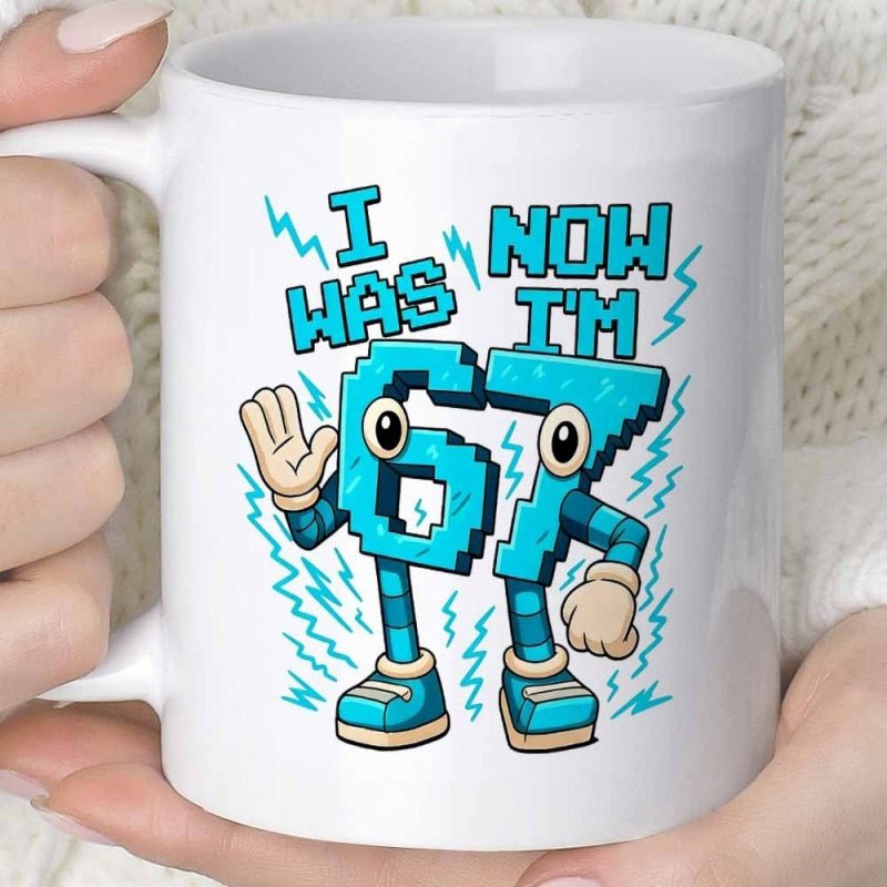 Tailorly White Ceramic 11 oz Mug - I Was Now Im 67 Vibrant Cyan Pixelated Number Character Surrounded By Electric Blue Lightning Bolts Character