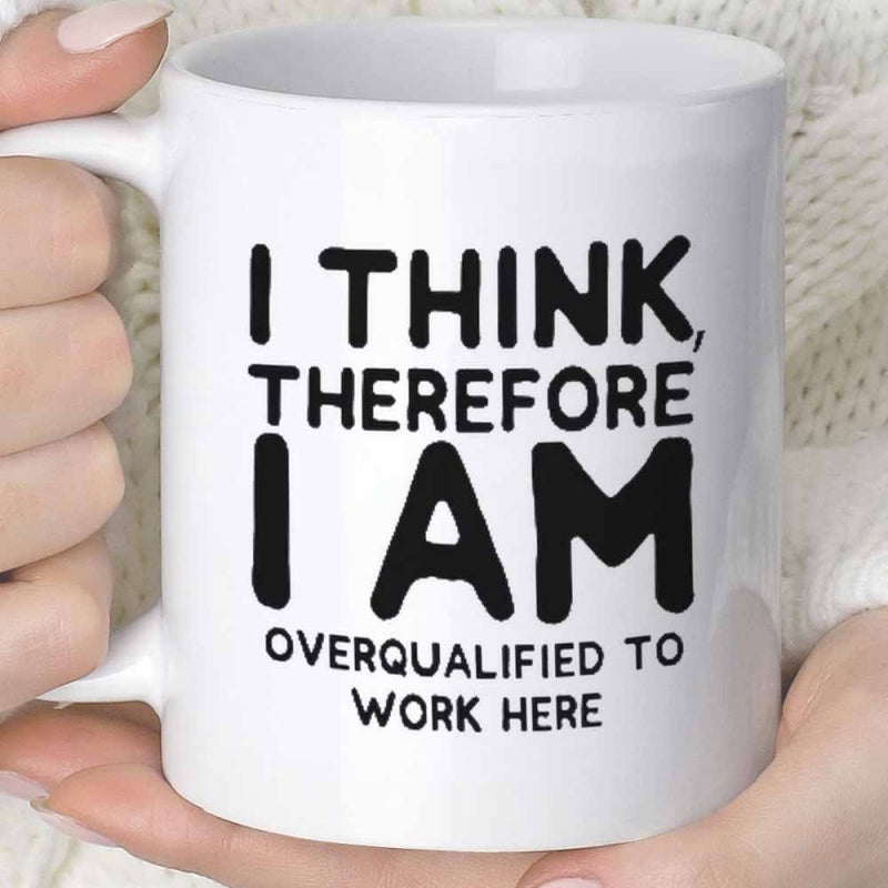 Tailorly White Ceramic 11 oz Mug - I Think Therefore I Am Overqualified To Work Here Simple White Ceramic Vessel Being Held By Hands Against Soft Background Mug