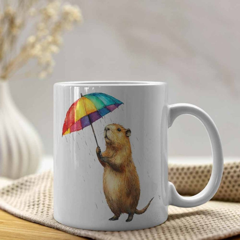Tailorly White Ceramic 11 oz Mug - Adorable Creature Standing Under A Vibrant Colorful Rainbow Umbrella Looking Upward Capybara