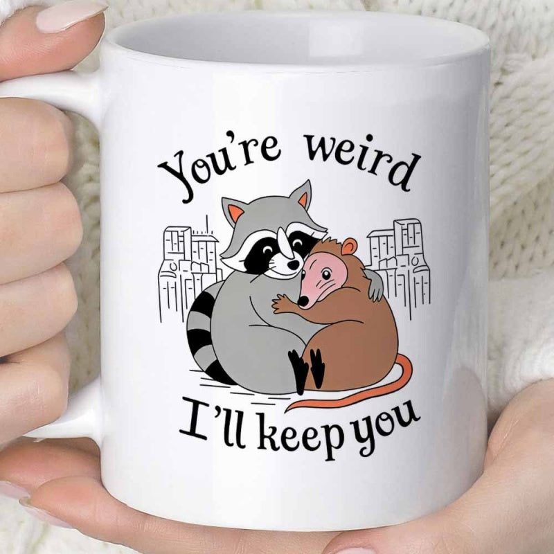 Tailorly White Ceramic 11 oz Mug - Youre Weird Ill Keep You Charming Cartoon Opossum Hugging Close With City Skyline Background Raccoon