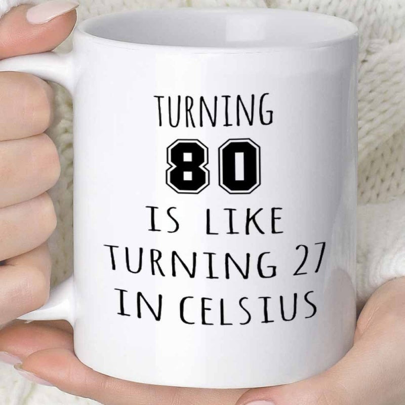 Tailorly White Ceramic 11 oz Mug - Turning 80 Is Like Turning 27 In Celsius Minimalist White Ceramic Vessel Displaying Humorous Birthday Message For Seniors Mug