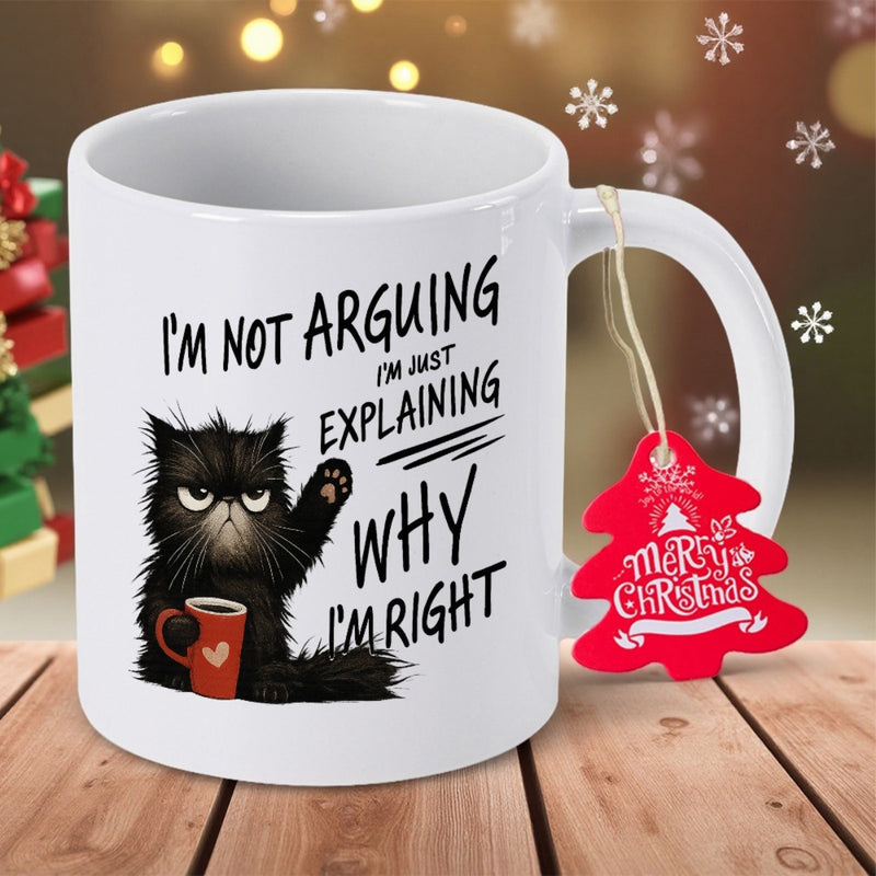 Tailorly White Ceramic 11 oz Mug - Im Not Arguing Im Just Explaining Why Im Right Grumpy Furry Black Holding A Red Heart Mug Looking Annoyed Cat