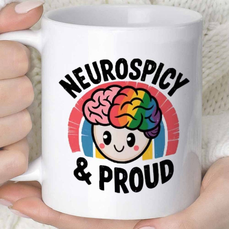 Tailorly White Ceramic 11 oz Mug - Neurospicy Proud Smiling Cartoon Character With Vibrant Rainbow Colors Behind Adorable Brain