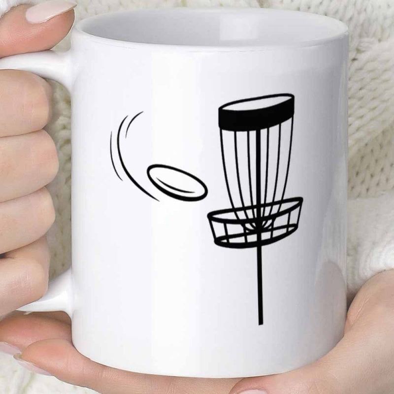 Tailorly White Ceramic 11 oz Mug - Sleek Flying Disc Soaring Toward A Minimalist Metal Wire Basket
