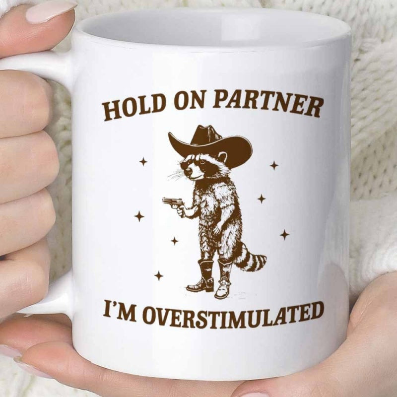Tailorly White Ceramic 11 oz Mug - Hold On Partner Im Overstimulated Rustic Vintage Cowboy Raccoon In A Hat Holding A Gun Raccoon