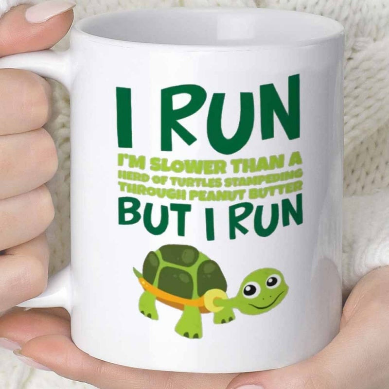 Tailorly White Ceramic 11 oz Mug - I Run Im Slower Than A Herd Of Turtles Stampeding Through Peanut Butter But I Run Green Cartoon Crawling Slowly Across Plain