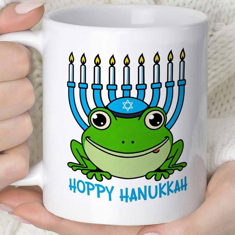 Tailorly White Ceramic 11 oz Mug - Hoppy Hanukkah Smiling Green Cartoon Frog Wearing Jewish Kippah Beneath Glowing Festive Menorah Frog