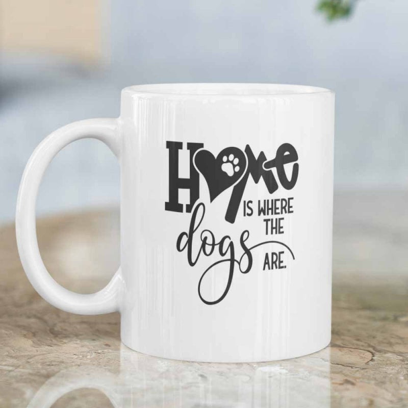 Tailorly White Ceramic 11 oz Mug - Home Is Where The Dogs Are Minimalist Black Typography Featuring Heart And Tiny Paw Print Silhouette Dog Slogan
