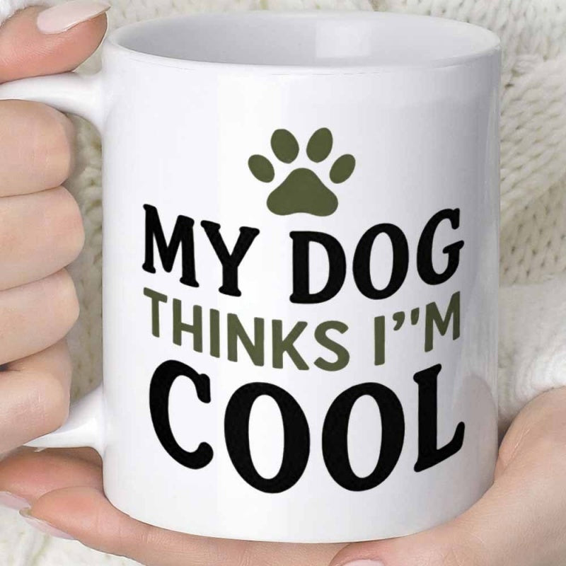 Tailorly White Ceramic 11 oz Mug - My Dog Thinks I M Cool Simple Olive Green Animal Track Symbol Centered Above Bold Text Paw Print