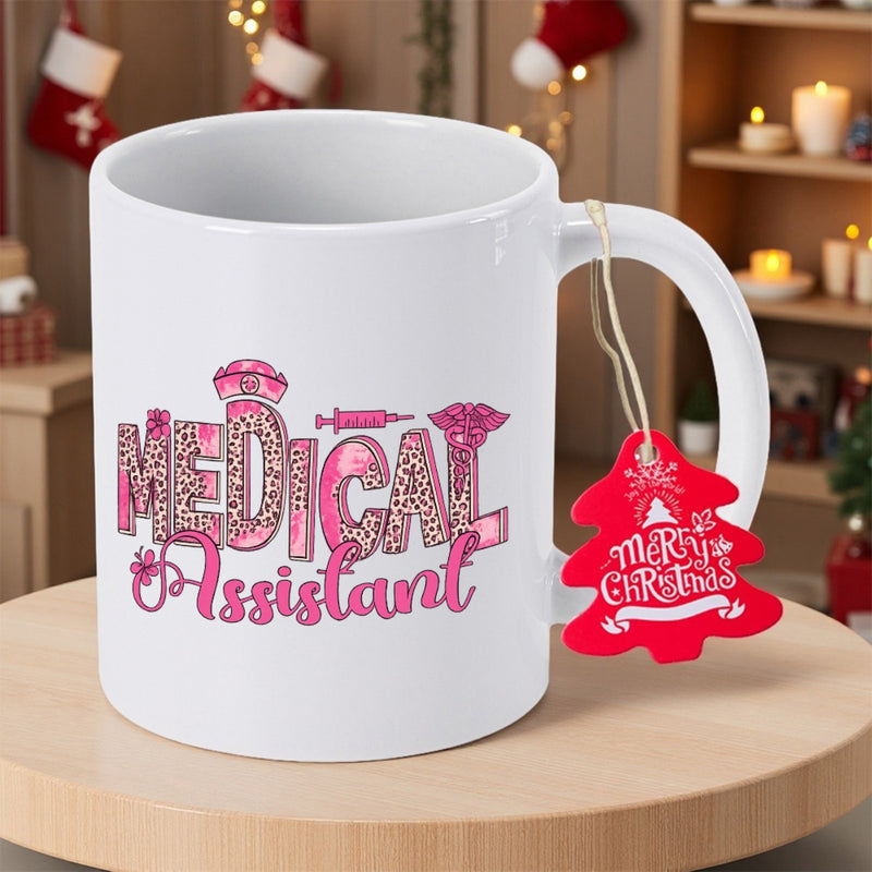 Tailorly White Ceramic 11 oz Mug - Medical Assistant Merry Christmas Stylized Pink Leopard Print Letters With Medical Symbols And Festive Tag Mug