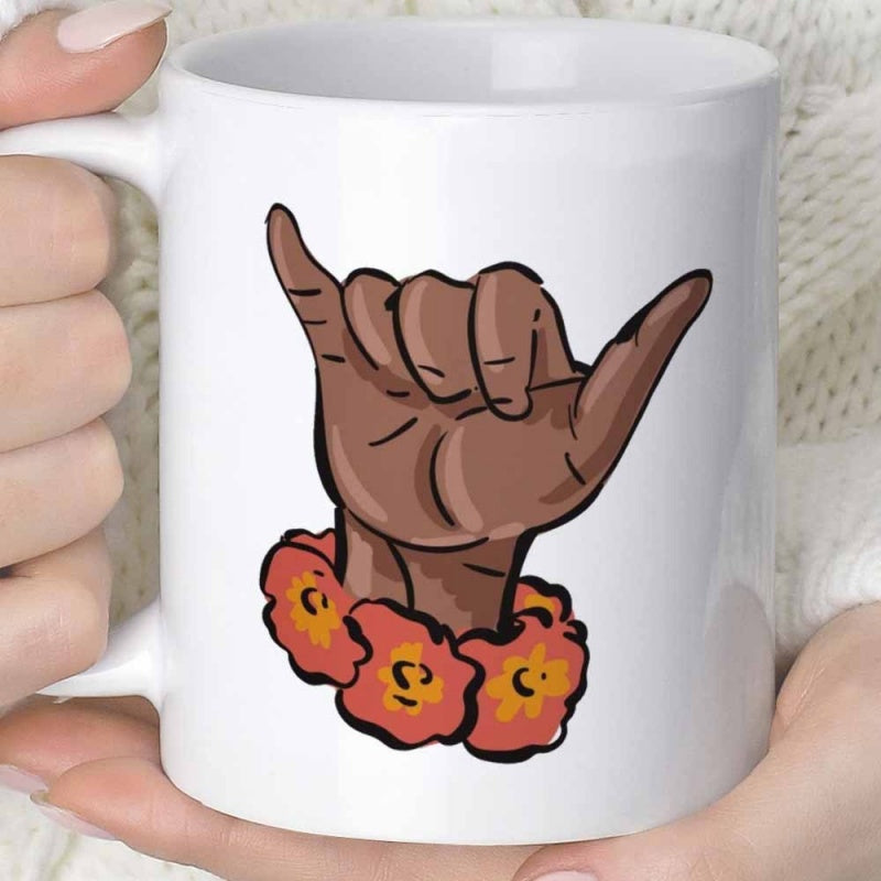 Tailorly White Ceramic 11 oz Mug - Illustrative Brown Shaka Sign Wearing Vibrant Tropical Hawaiian Flower Lei Hand