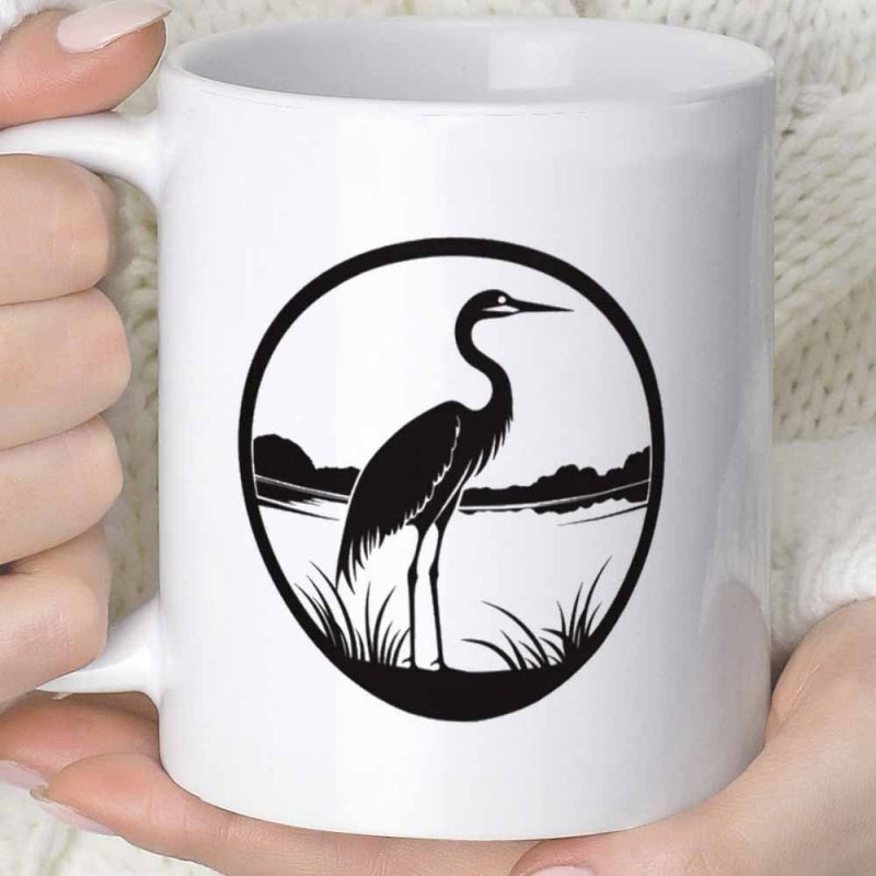 Tailorly White Ceramic 11 oz Mug - Minimalist Circular Frame Featuring A Majestic Crane Standing Among Serene Reeds Heron