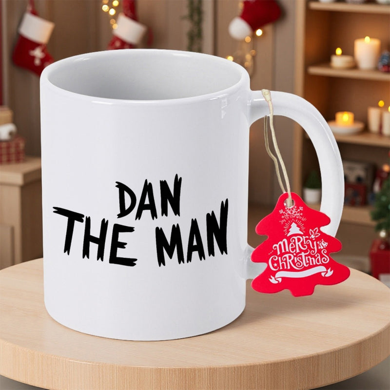 Tailorly White Ceramic 11 oz Mug - Dan The Man Merry Christmas Minimalist White Ceramic Vessel Featuring Festive Red Holiday Tree Hanging Ornament Mug