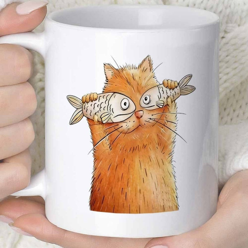 Tailorly White Ceramic 11 oz Mug - Funny Playful Orange Feline Holding Two Fish Over Its Eyes Cat