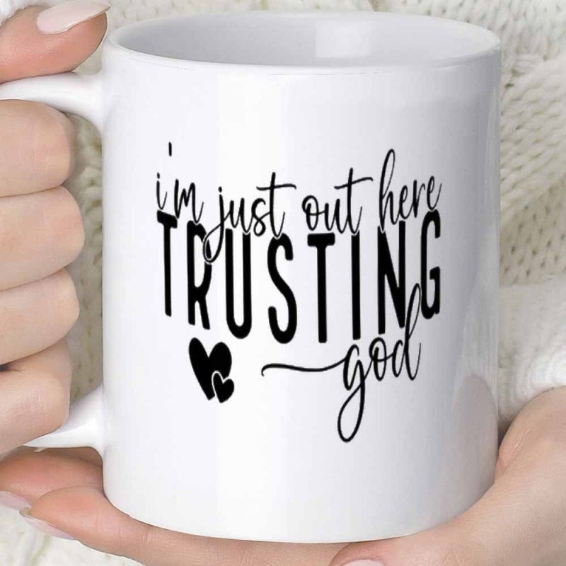 Tailorly White Ceramic 11 oz Mug - Im Just Out Here Trusting God Two Small Black Hearts Set Against A Minimalist White Background Mug