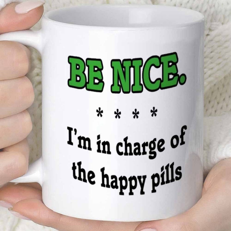 Tailorly White Ceramic 11 oz Mug - Be Nice Im In Charge Of The Happy Pills Bold Vibrant Green Lettering With Elegant Black Serif Typography Design Sign
