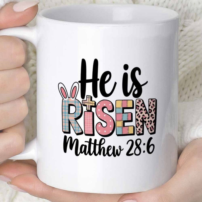 Tailorly White Ceramic 11 oz Mug - He Is Risen Matthew 28 6 Stylized Decorative Letters Featuring Easter Bunny Ears And Small Holy Cross Mug