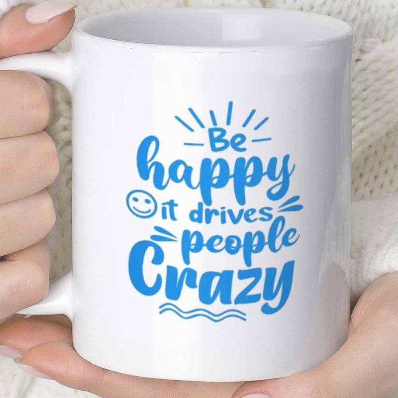 Tailorly White Ceramic 11 oz Mug - Be Happy It Drives People Crazy Blue Stylized Script Typography Featuring Decorative Radiant Lines And Small Smile Mug