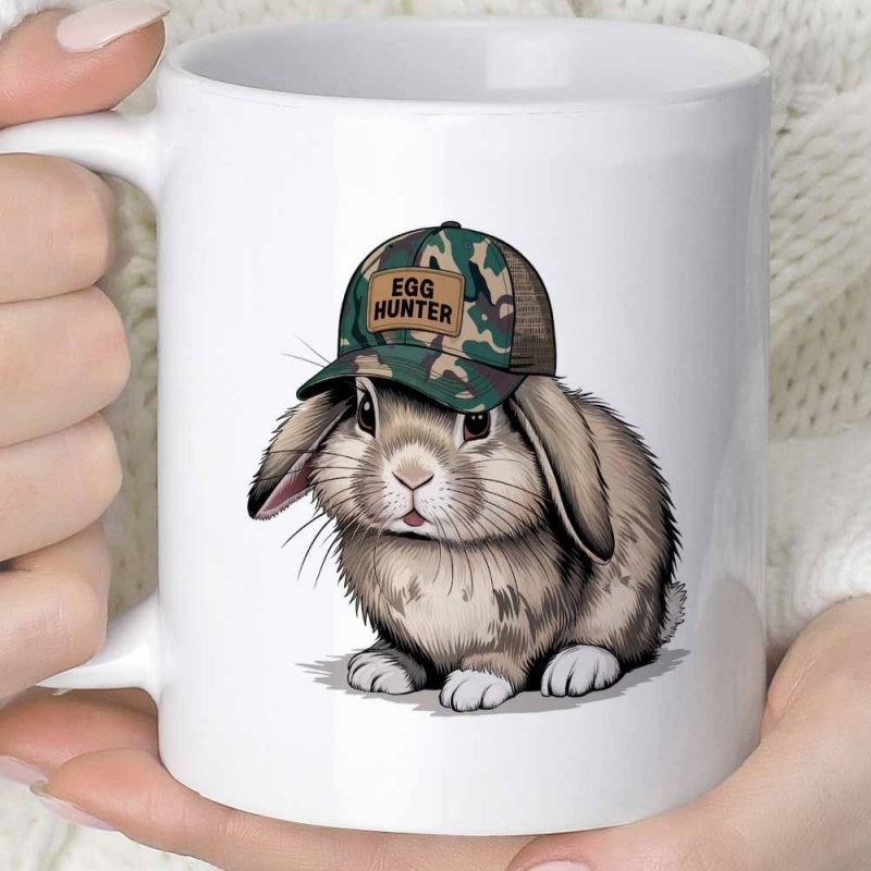 Tailorly White Ceramic 11 oz Mug - Egg Hunter Wearing Camouflage Baseball Cap Sitting Peacefully On White Surface Rabbit