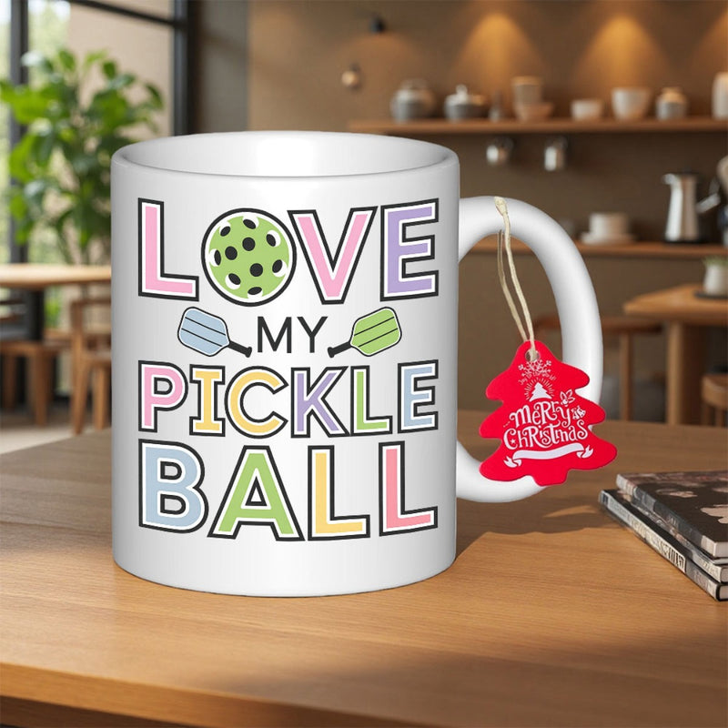Tailorly White Ceramic 11 oz Mug - Love My Pickle Ball Vibrant Pastel Outlined Letters Between Two Sporting Paddles And Pickleball