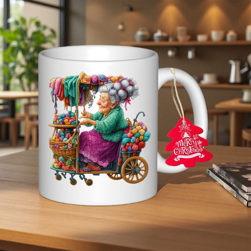 Tailorly White Ceramic 11 oz Mug - Merry Christmas Whimsical Old Lady Sitting In Cart Filled With Colorful Wool Grandmother