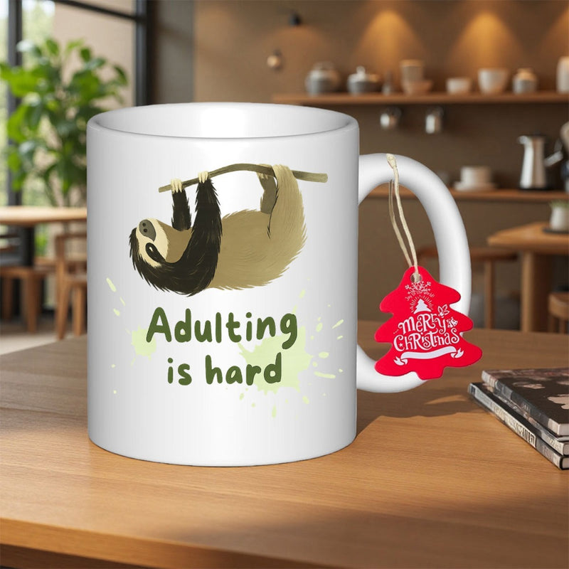 Tailorly White Ceramic 11 oz Mug - Adulting Is Hard Illustrative Brown Sloth Hanging From Branch Against Clean White Ceramic Sloth