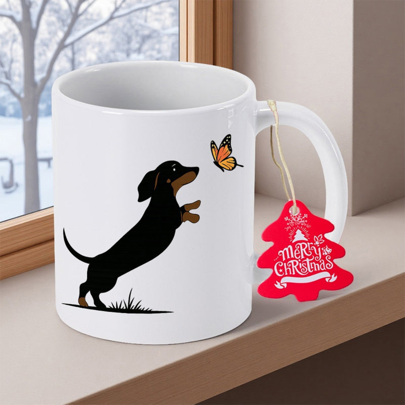 Tailorly White Ceramic 11 oz Mug - Merry Christmas Playful Black And Tan Puppy Reaching For A Colorful Delicate Butterfly Dachshund
