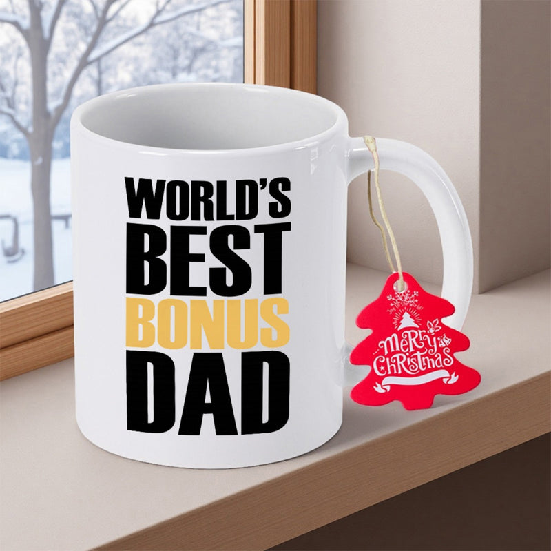 Tailorly White Ceramic 11 oz Mug - Worlds Best Bonus Dad Pure White Ceramic Vessel Beside Window With Festive Red Tree Mug