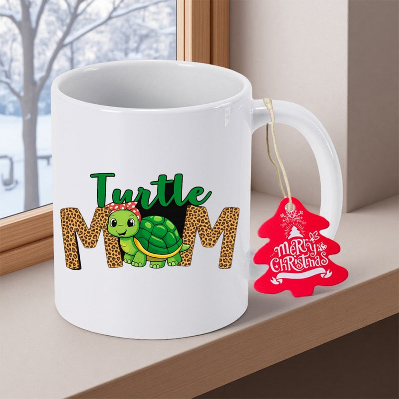 Tailorly White Ceramic 11 oz Mug - Turtle Mom Merry Christmas Adorable Green Reptile With Headband Nestled Between Large Leopard Patterned Letters Turtle