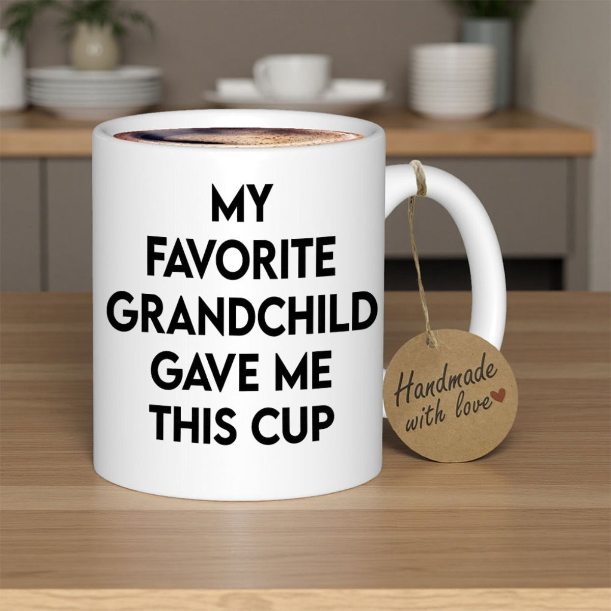 Tailorly White Ceramic 11 oz Mug - My Favorite Grandchild Gave Me This Cup Plain White Surface With Simple Bold Characters Under Soft Indoor Lighting Mug