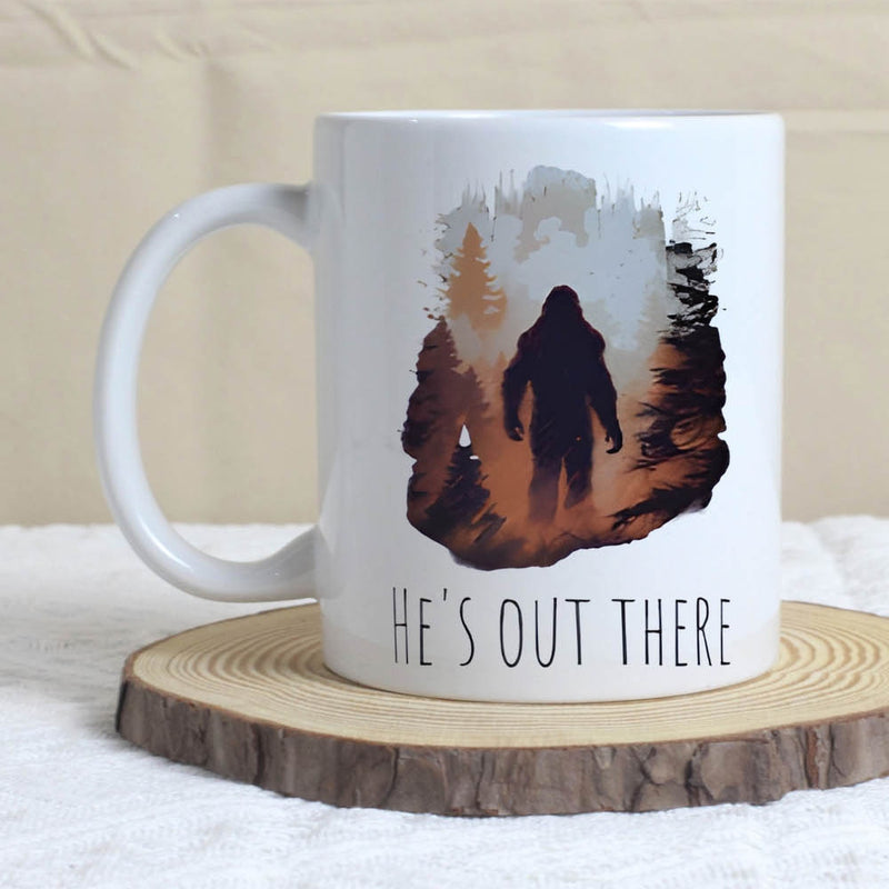 Tailorly White Ceramic 11 oz Mug - Hes Out There Mysterious Distressed Silhouette Walking Through Dense Pine Forest Bigfoot