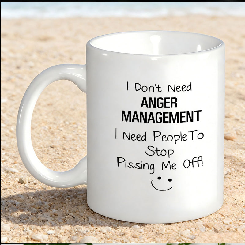 Tailorly White Ceramic 11 oz Mug - I Don't Need Anger Management I Need People To Stop Pissing Me Off Minimalist White Ceramic Coffee Vessel Resting On Soft Beach
