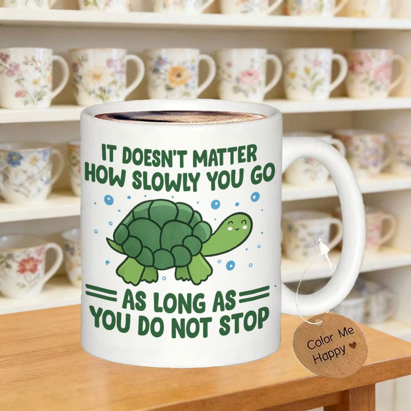 Tailorly White Ceramic 11 oz Mug - It Doesnt Matter How Slowly You Go As Long As You Do Not Stop Cheerful Green Cartoon Turtle Smiling Under Floating Small Blue