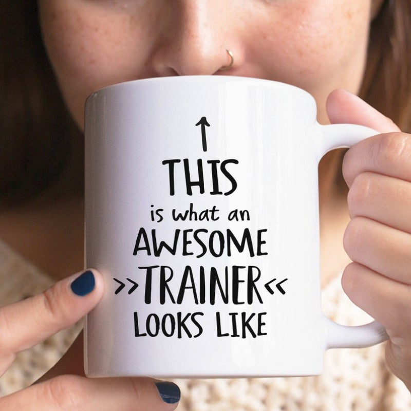 Tailorly White Ceramic 11 oz Mug - This Is What An Awesome Trainer Looks Like Clean With Simple Black Arrows And Slogan Mug