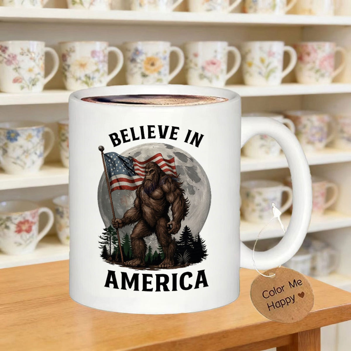 Tailorly White Ceramic 11 oz Mug - Believe In America Holding American Flag Standing In Forest Under Large Glowing Full Moon Sasquatch