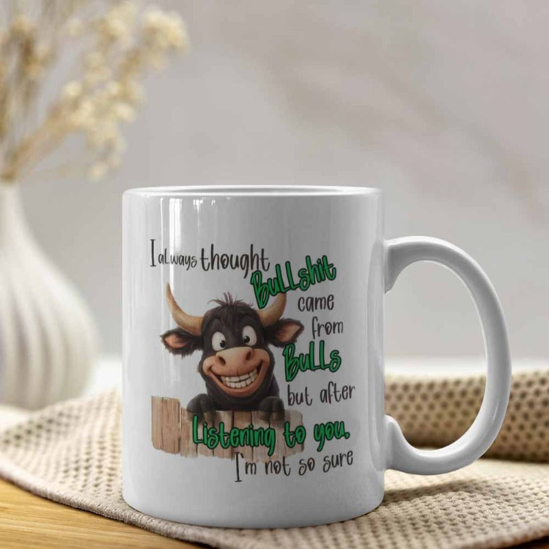 Tailorly White Ceramic 11 oz Mug - I Always Thought Bullshit Came From Bulls But After Listening To You Im Not So Sure Friendly Cartoon Bull Peering Over A Rustic