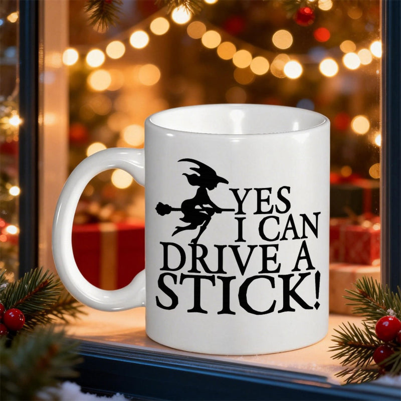 Tailorly White Ceramic 11 oz Mug - Yes I Can Drive A Stick Silhouette Flying On Broomstick Under Festive Christmas Lights Background In Winter Witch
