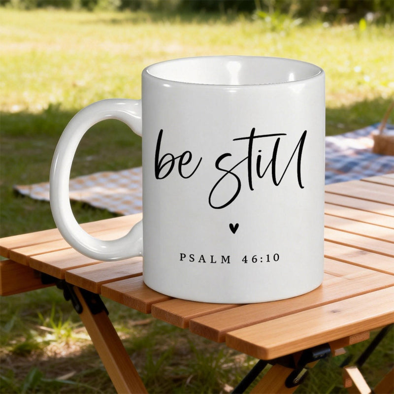 Tailorly White Ceramic 11 oz Mug - Be Still Psalm 46 10 Minimalist Small Solid Black Symbol Placed Under Inspirational Text Heart