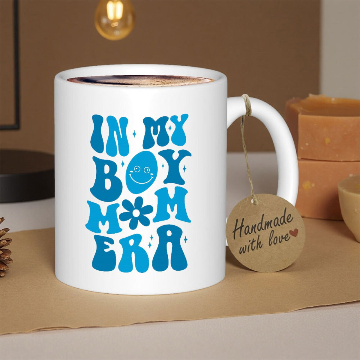 Tailorly White Ceramic 11 oz Mug - In My Boy Mom Era Blue Retro Groovy Lettering Featuring Simple Smiley Face And Small Flower Pattern Mug