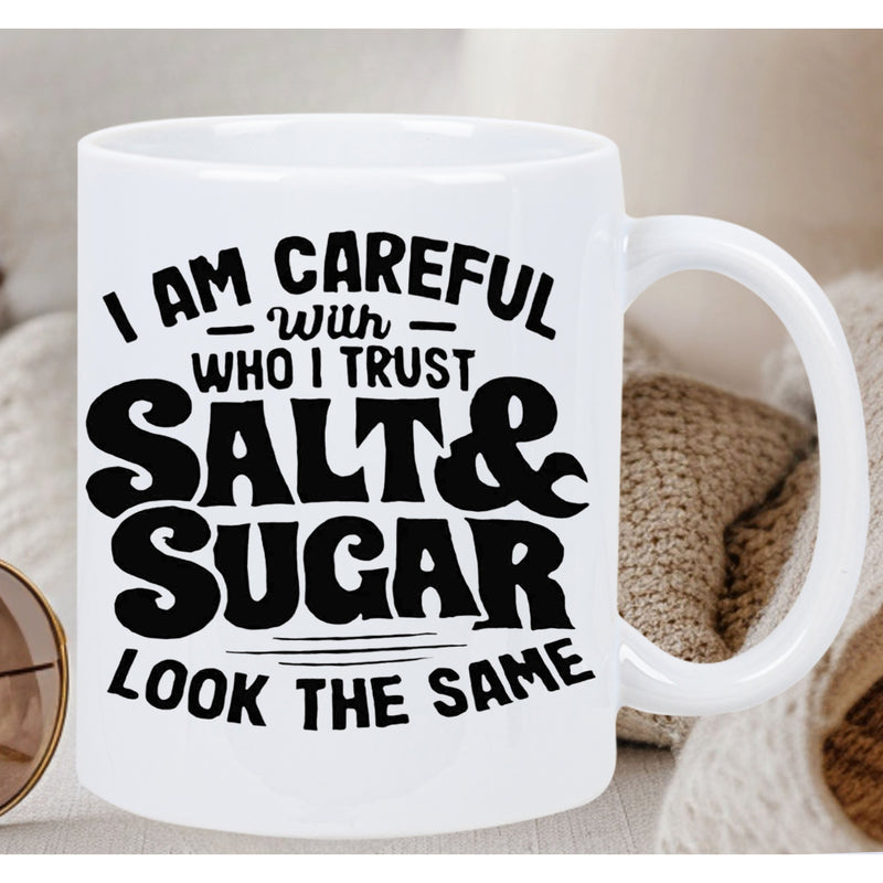 Tailorly White Ceramic 11 oz Mug - I Am Careful With Who I Trust Salt Sugar Look The Same Bold Stylized Retro Font With Decorative Horizontal Line Accents Quote