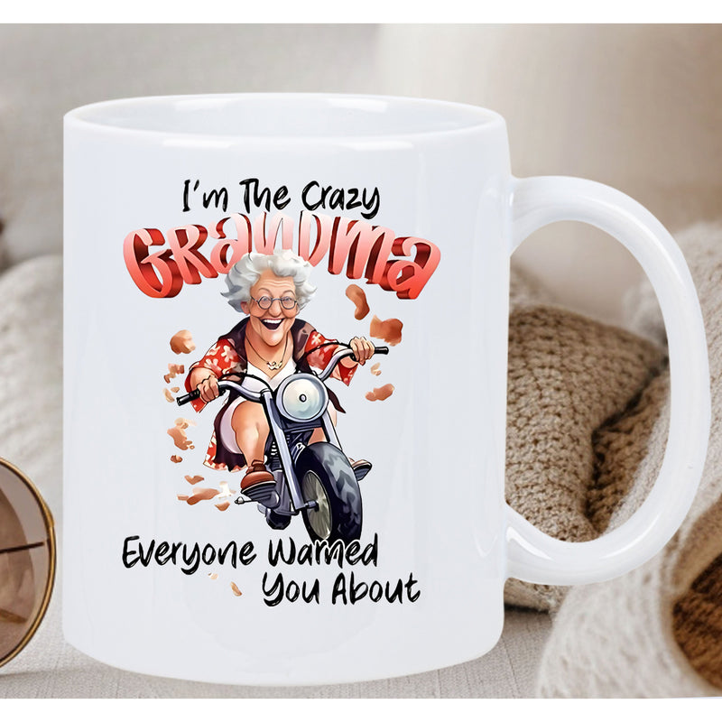 Tailorly White Ceramic 11 oz Mug - Im The Crazy Grandma Everyone Warned You About Elderly Woman Riding A Powerful Motorcycle Through Floating Dust Particles