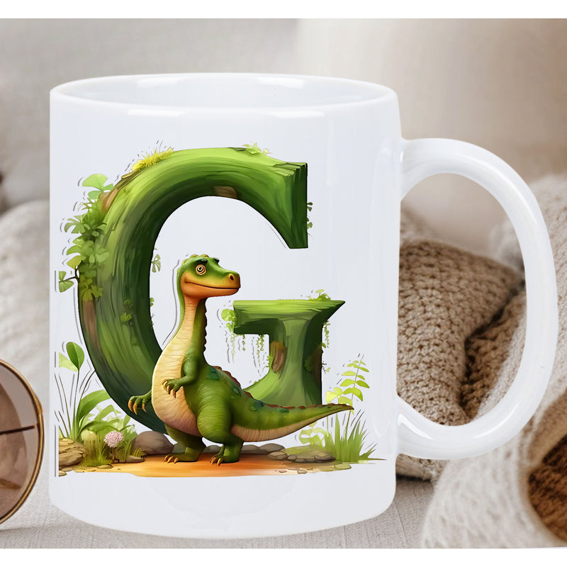 Tailorly White Ceramic 11 oz Mug - G Playful Little Creature Resting Against A Large Mossy Green Letter Dinosaur