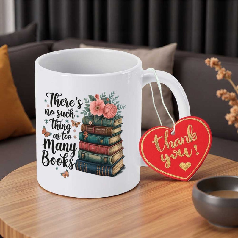 Tailorly White Ceramic 11 oz Mug - Theres No Such Thing As Too Many Books Delicate Pink Flowers Resting Atop A Stacked Pile Of Vintage Books